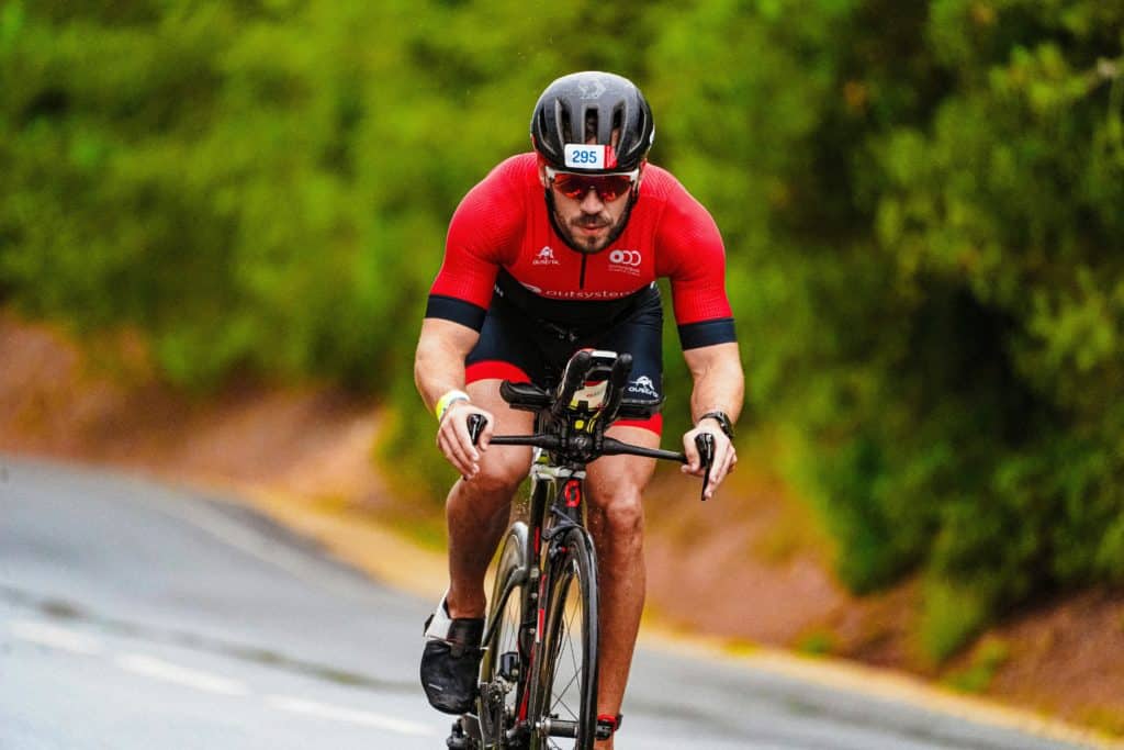 Man riding a bike competing in a triathlon at Bewl Water